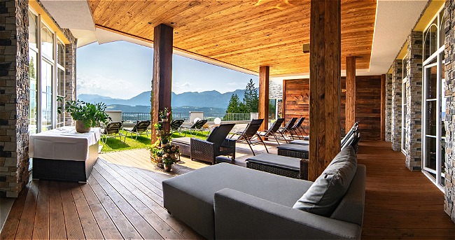 Sheltered outdoor relaxation area with panoramic view  